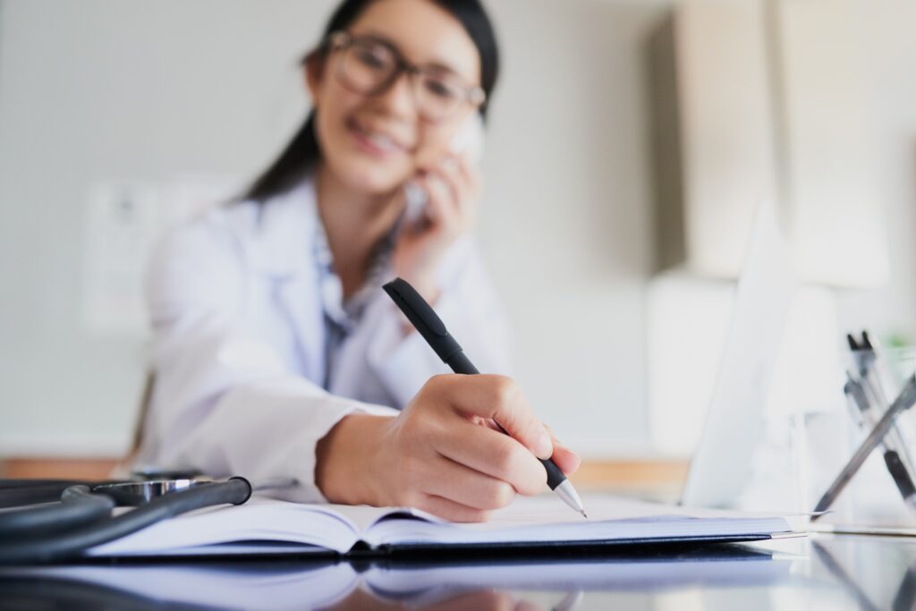 Nurse on the phone during a Chronic Care Management check-in with a patient